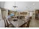 This open concept living space includes a dining area, kitchen, and living room at 27421 N 22Nd Ln, Phoenix, AZ 85085