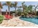Inviting pool area with comfortable lounge chairs, a built-in BBQ, and lush landscaping creating a backyard oasis at 27421 N 22Nd Ln, Phoenix, AZ 85085