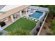 Aerial view of the meticulously designed backyard featuring a covered patio and a sparkling pool at 2982 S Holguin Way, Chandler, AZ 85286