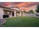 Spacious backyard with grassy area, patio, outdoor furniture and pool for entertaining at 2982 S Holguin Way, Chandler, AZ 85286