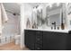 Elegant bathroom with a double vanity, black cabinets, and modern fixtures, offering a sleek and stylish design at 2982 S Holguin Way, Chandler, AZ 85286