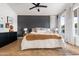 Stylish bedroom featuring a dark accent wall, neutral tones, and modern decor, offering a relaxing and inviting space at 2982 S Holguin Way, Chandler, AZ 85286