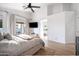 Spacious bedroom with high ceilings, a ceiling fan, and a sliding door to the patio, offering comfort and style at 2982 S Holguin Way, Chandler, AZ 85286