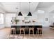 Bright and airy kitchen with white cabinets, a large island, and modern pendant lighting at 2982 S Holguin Way, Chandler, AZ 85286