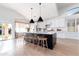 Bright open kitchen with a large center island, pendant lighting, and modern appliances at 2982 S Holguin Way, Chandler, AZ 85286