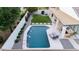 A beautiful pool area with lush greenery, a charming covered patio, and a serene outdoor space at 2982 S Holguin Way, Chandler, AZ 85286