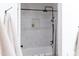 Shower with white subway tile, modern fixtures, and a built-in niche, creating a clean and functional space at 2982 S Holguin Way, Chandler, AZ 85286