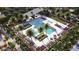 Aerial view of a resort-style community pool surrounded by palm trees, lounge chairs, and lush landscaping at 3344 S Lotus Ave, Mesa, AZ 85212