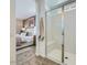 Modern bathroom with a glass-enclosed shower and a view of the main bedroom at 3344 S Lotus Ave, Mesa, AZ 85212