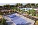 Community pickleball courts surrounded by lush landscaping, benches, community pool and manicured greenery at 3344 S Lotus Ave, Mesa, AZ 85212