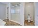 Bright bathroom featuring a glass-enclosed shower, toilet, and neutral color palette at 3893 E Gideon Way, Gilbert, AZ 85296
