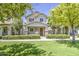 Beautiful two-story home with a manicured front yard and stone accents on the porch columns at 3893 E Gideon Way, Gilbert, AZ 85296