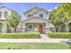 Charming two-story home featuring a welcoming front porch with stone accents and manicured landscaping at 3893 E Gideon Way, Gilbert, AZ 85296