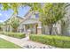 Beautiful home featuring lush green trees and landscaping that frame this charming two-story home at 3893 E Gideon Way, Gilbert, AZ 85296