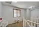 Upstairs hallway area featuring a play area and a window with blinds at 3893 E Gideon Way, Gilbert, AZ 85296