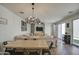Spacious living room features a dining area and seamless access to the patio, with neutral decor at 3893 E Gideon Way, Gilbert, AZ 85296