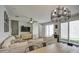 Open-concept living space with modern furniture, a cozy sectional, and plenty of natural light at 3893 E Gideon Way, Gilbert, AZ 85296