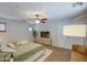 Spacious main bedroom with ample lighting, a modern ceiling fan, and neutral colored walls at 3893 E Gideon Way, Gilbert, AZ 85296