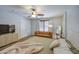 Comfortable main bedroom suite with large windows, a leather couch, and ample lighting at 3893 E Gideon Way, Gilbert, AZ 85296