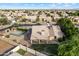 Aerial view of a home featuring a backyard basketball court, patio, and green landscaping at 4220 E San Angelo Ave, Gilbert, AZ 85234