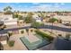 Aerial view of a backyard basketball court in a community with well-maintained homes and landscaping at 4220 E San Angelo Ave, Gilbert, AZ 85234