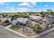 Aerial view of a property showcasing a well-maintained yard, outdoor space, and neighborhood at 4220 E San Angelo Ave, Gilbert, AZ 85234