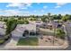 Aerial view showcasing the property's curb appeal, landscaped yard, and neighborhood at 4220 E San Angelo Ave, Gilbert, AZ 85234
