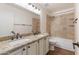 Bathroom featuring a double vanity with granite counters and a bathtub at 4220 E San Angelo Ave, Gilbert, AZ 85234