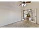 Bedroom with carpeted floors and french doors leading to the dining area at 4220 E San Angelo Ave, Gilbert, AZ 85234