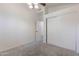 Bedroom featuring a ceiling fan, a closet with sliding doors, and carpeted floors at 4220 E San Angelo Ave, Gilbert, AZ 85234