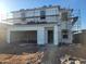 Two story home under construction with stacked roofing tiles and a two-car garage at 4248 E Kolin Ln, San Tan Valley, AZ 85143