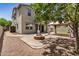 Well-maintained backyard with mature landscaping, gazebo, and cozy fire pit area at 4258 E Lexington Ave, Gilbert, AZ 85234