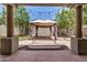 View of the backyard, showcasing a gazebo with curtains and patio for entertaining at 4258 E Lexington Ave, Gilbert, AZ 85234