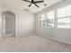 Bedroom with carpet, neutral walls, ceiling fan, and bright windows at 4258 E Lexington Ave, Gilbert, AZ 85234