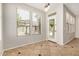 Bright dining area with tile floors, large windows, and access to the backyard at 4258 E Lexington Ave, Gilbert, AZ 85234