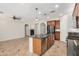 Modern kitchen with granite countertops, stainless steel appliances, and an island at 4258 E Lexington Ave, Gilbert, AZ 85234
