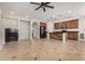 Open-concept kitchen and living area with a fireplace and stainless steel appliances at 4258 E Lexington Ave, Gilbert, AZ 85234