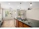Kitchen island featuring granite countertops, stainless steel appliances, and tile floors at 4258 E Lexington Ave, Gilbert, AZ 85234