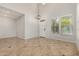 Bright, open-concept living room with tile flooring and large windows for natural light at 4258 E Lexington Ave, Gilbert, AZ 85234