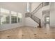 Bright, open-concept living room with tile flooring and large windows for natural light at 4258 E Lexington Ave, Gilbert, AZ 85234