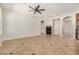 Open-concept living room featuring a fireplace and tile floors at 4258 E Lexington Ave, Gilbert, AZ 85234