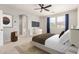 Comfortable main bedroom with plush bedding, a ceiling fan, and a bright window at 4258 E Lexington Ave, Gilbert, AZ 85234
