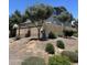 The home's backyard features lush landscaping and a sturdy fence, creating a private outdoor oasis at 4490 S Montana Dr, Chandler, AZ 85248
