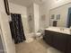 Well-lit bathroom features a shower-tub combo and dark wood vanity at 4490 S Montana Dr, Chandler, AZ 85248