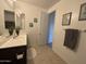 Spacious bathroom with a large mirror, vanity, and decorative wall hangings at 4490 S Montana Dr, Chandler, AZ 85248