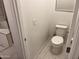 Bathroom featuring a toilet and light switches at 4490 S Montana Dr, Chandler, AZ 85248