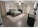 Spacious bedroom with a large bed, ceiling fan, and a walk in closet at 4490 S Montana Dr, Chandler, AZ 85248