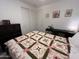 Comfortable bedroom with lots of natural light features neutral walls and a stylish quilt at 4490 S Montana Dr, Chandler, AZ 85248
