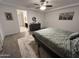 Bright bedroom featuring a ceiling fan, bed, and paintings on the wall at 4490 S Montana Dr, Chandler, AZ 85248