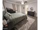Bedroom featuring a bed, ceiling fan, and a walk in closet at 4490 S Montana Dr, Chandler, AZ 85248
